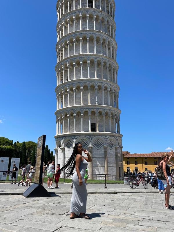 Student standing in front of Pisa